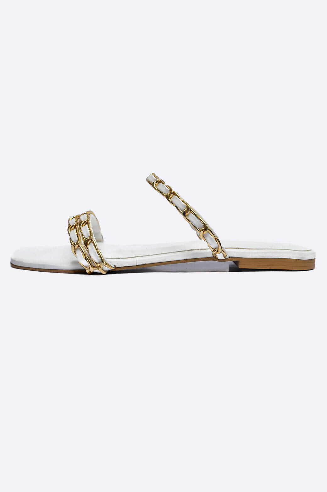 Luna Luxe handmade white leather slip-on shoes with gold chain links, perfect for ladies' footwear, designed in UAE.