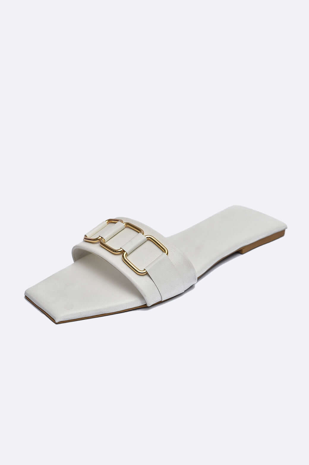 Handmade white leather slide shoes with matte-gold buckles by Cool Cami, perfect for ladies footwear in the UAE.