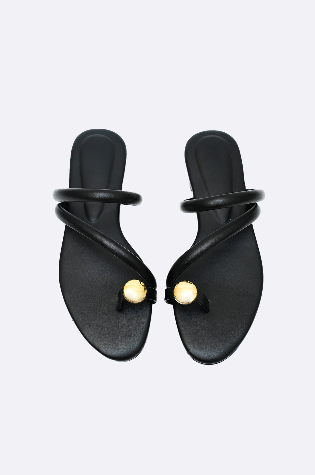 Cool Cami black leather handmade flat sandal with gold toe detail and double straps, luxury minimalist footwear for women from UAE.