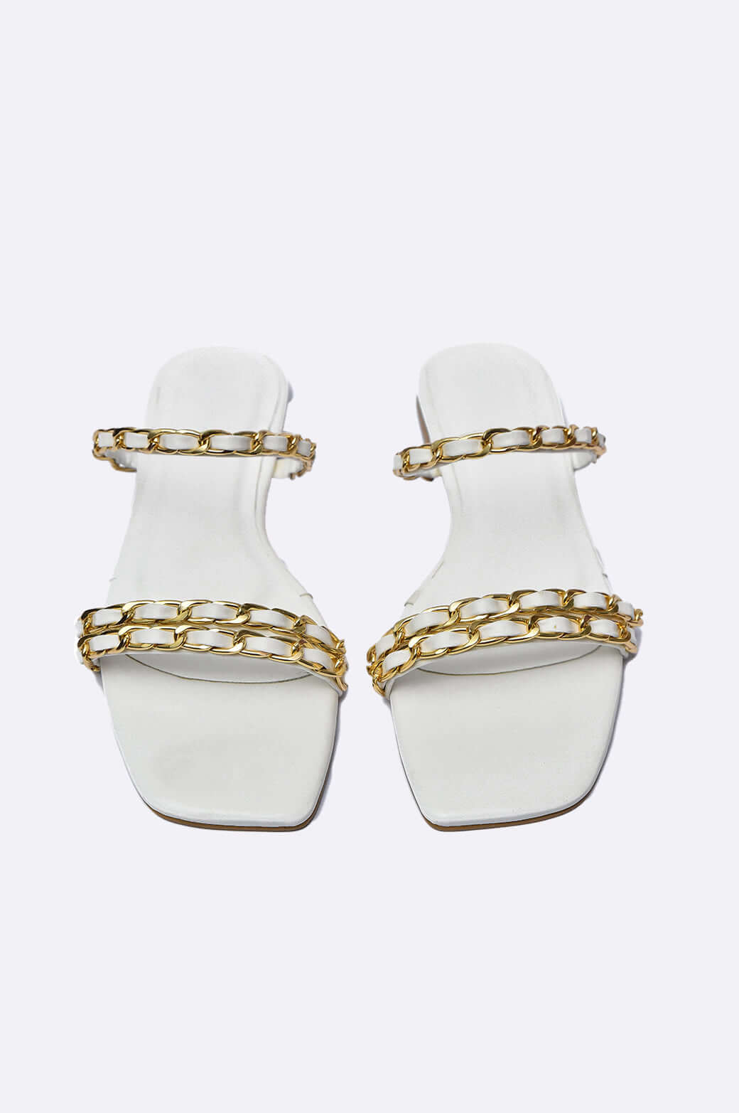 Handmade Luna Luxe slippers in white leather with gold-plated chain links, perfect for minimalist glam and curated wardrobes.