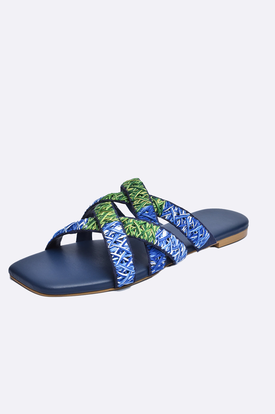 Cool Cami handmade leather flat slipper with blue and green embroidered cross-straps on navy sole, luxury women’s footwear from UAE.