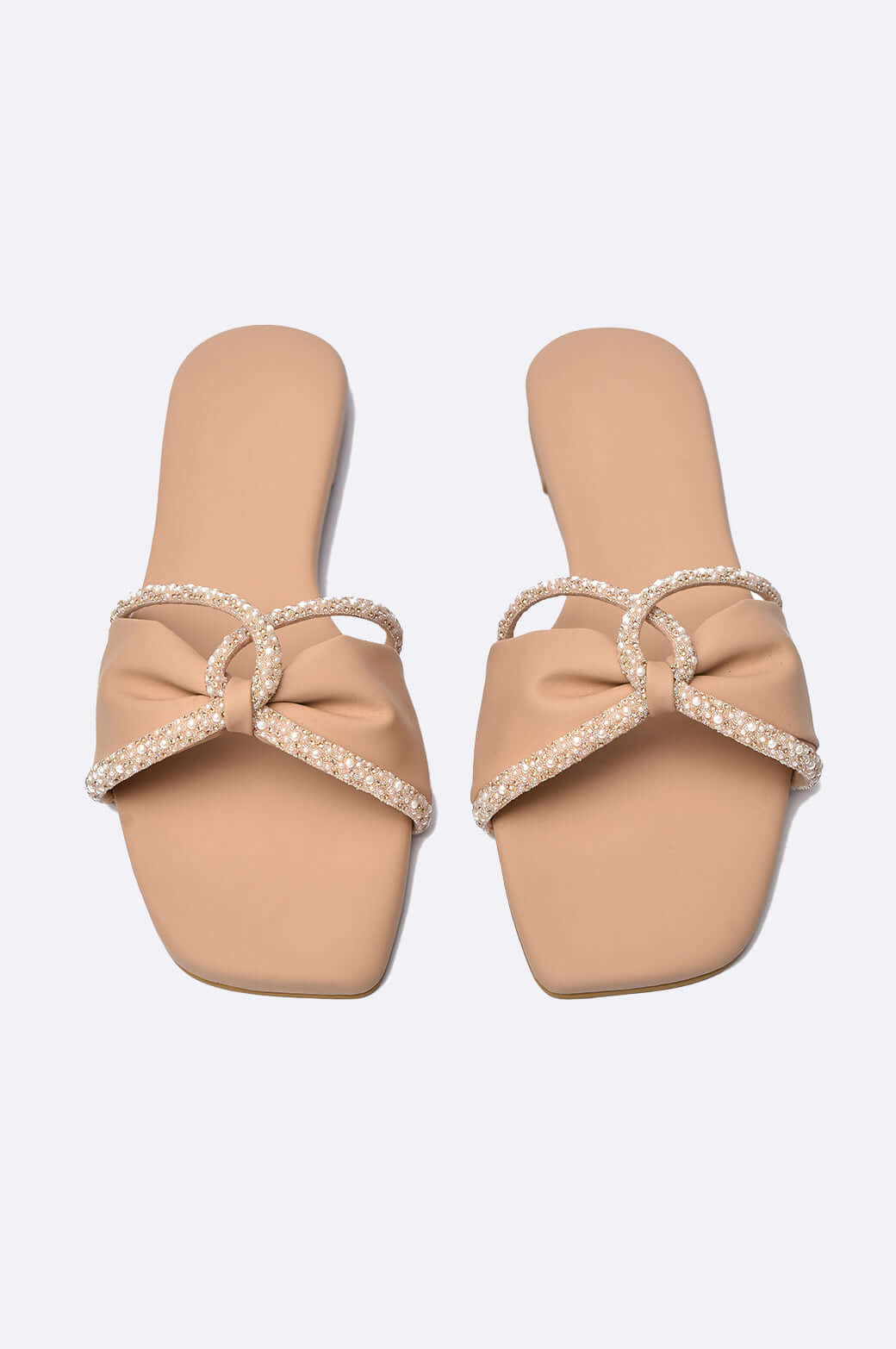 Handmade Blush Pearl slippers in nude leather with pearl embellishments, elegant ladies footwear from UAE.