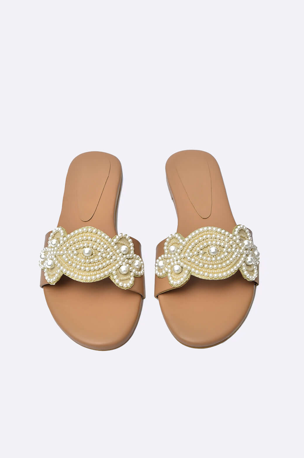 Handmade tan leather flats for ladies, adorned with pearl 3D floral appliqué, perfect for UAE festive occasions.